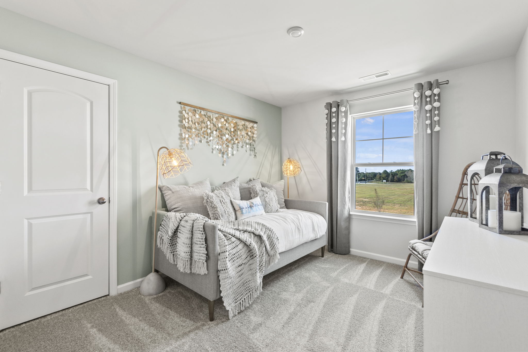 A bedroom with a large bed.