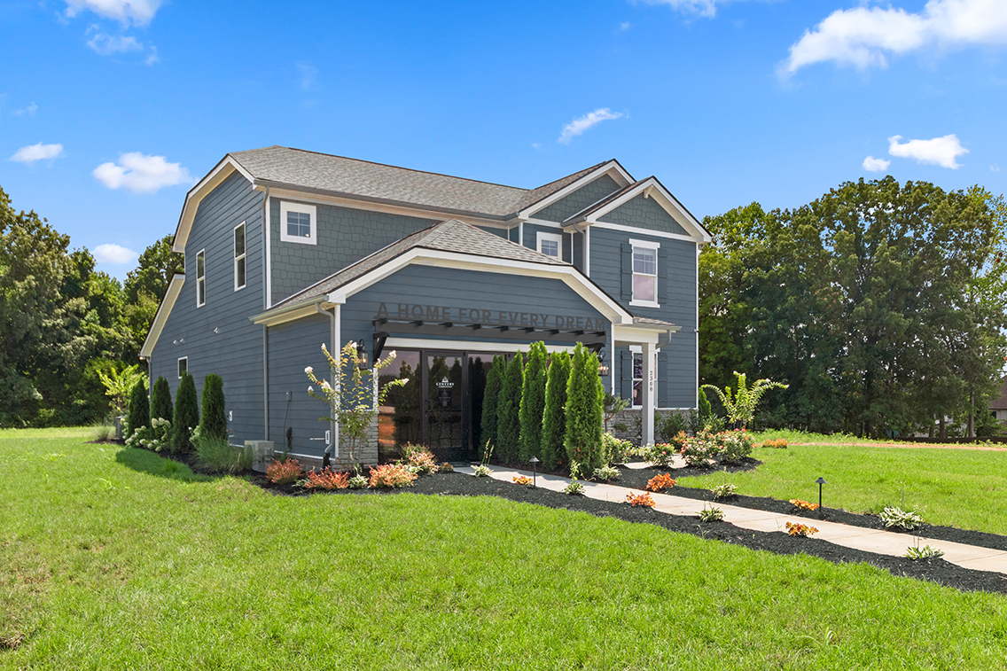 A house with a large front yard.