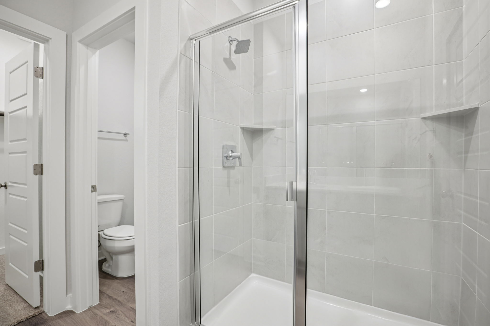 A bathroom with a glass shower.