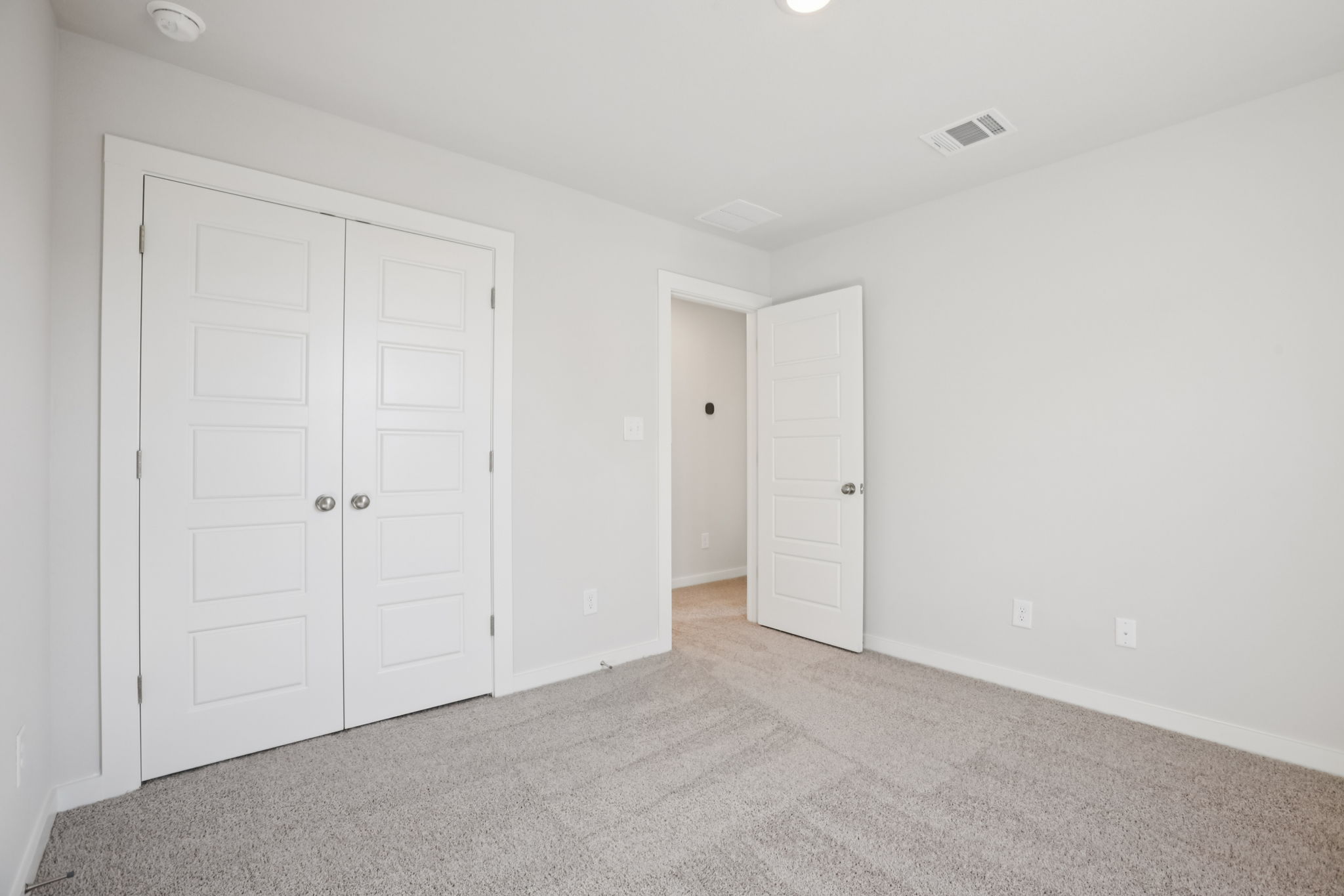 A room with white doors.