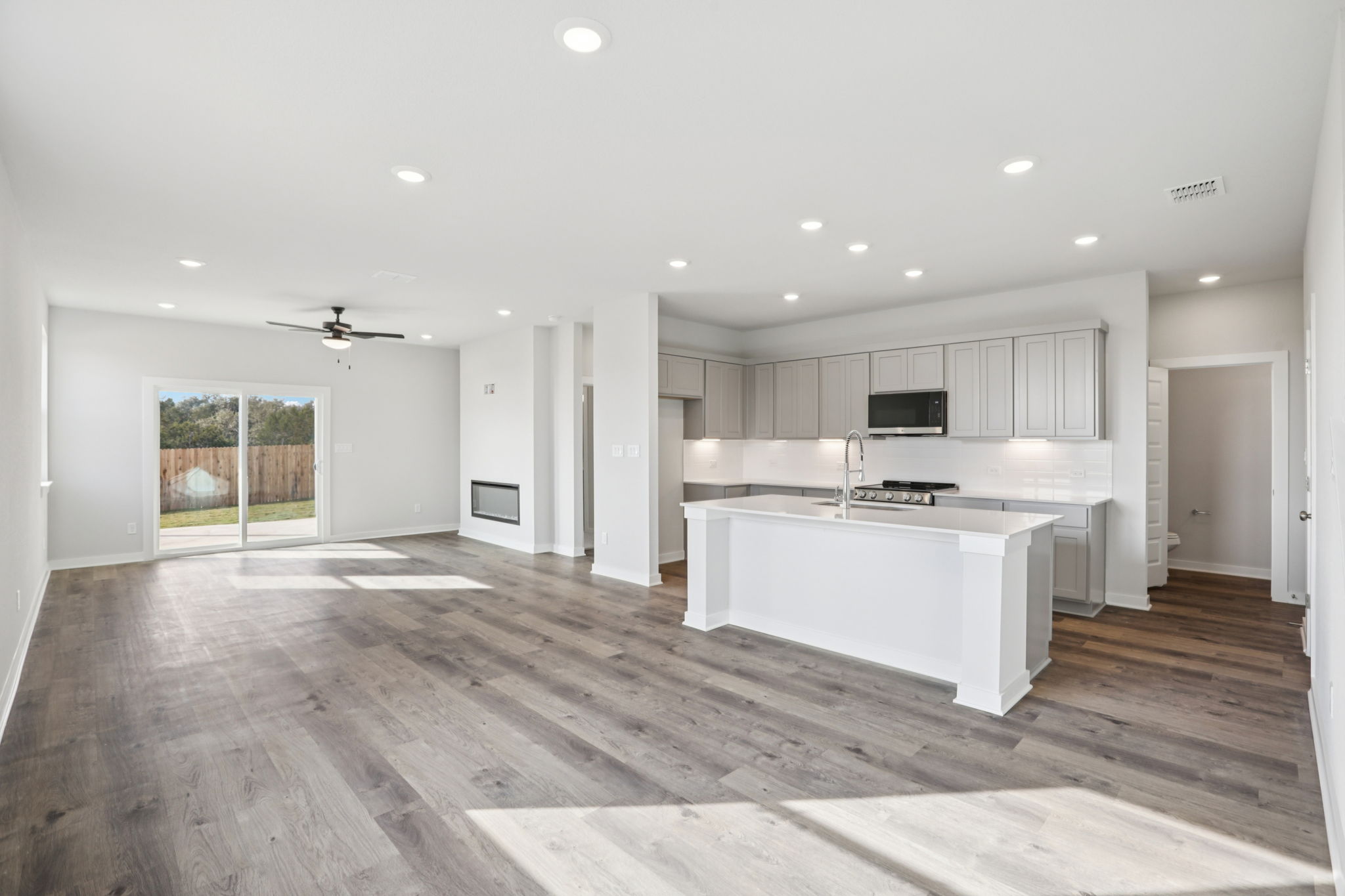 A large kitchen with white cabinets.