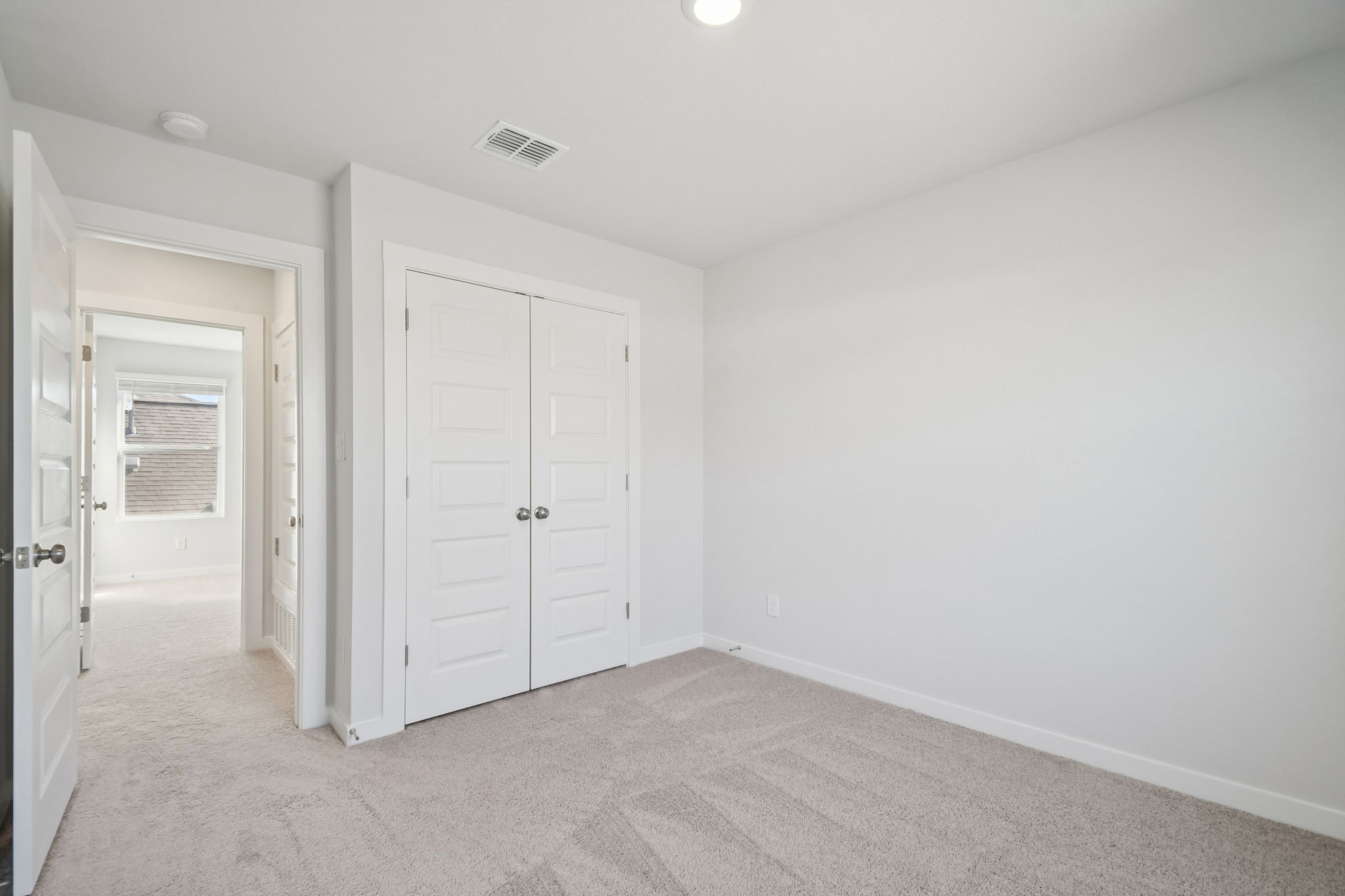 A room with white doors.