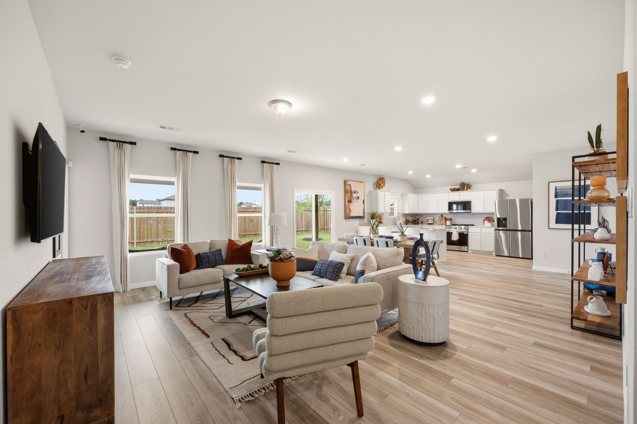 A living room with a wood floor.