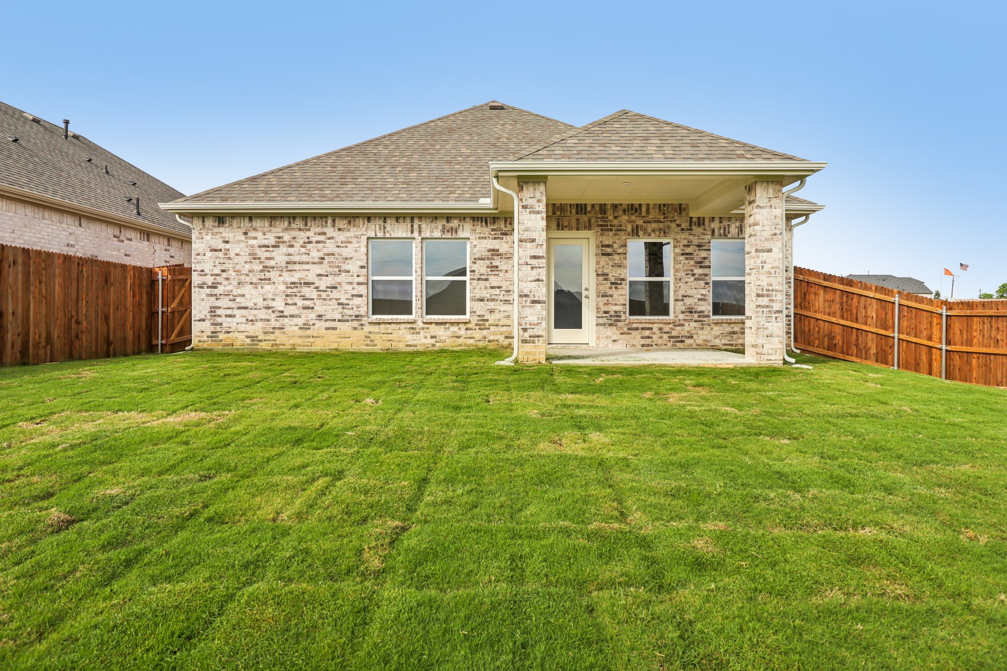 A house with a grass yard.