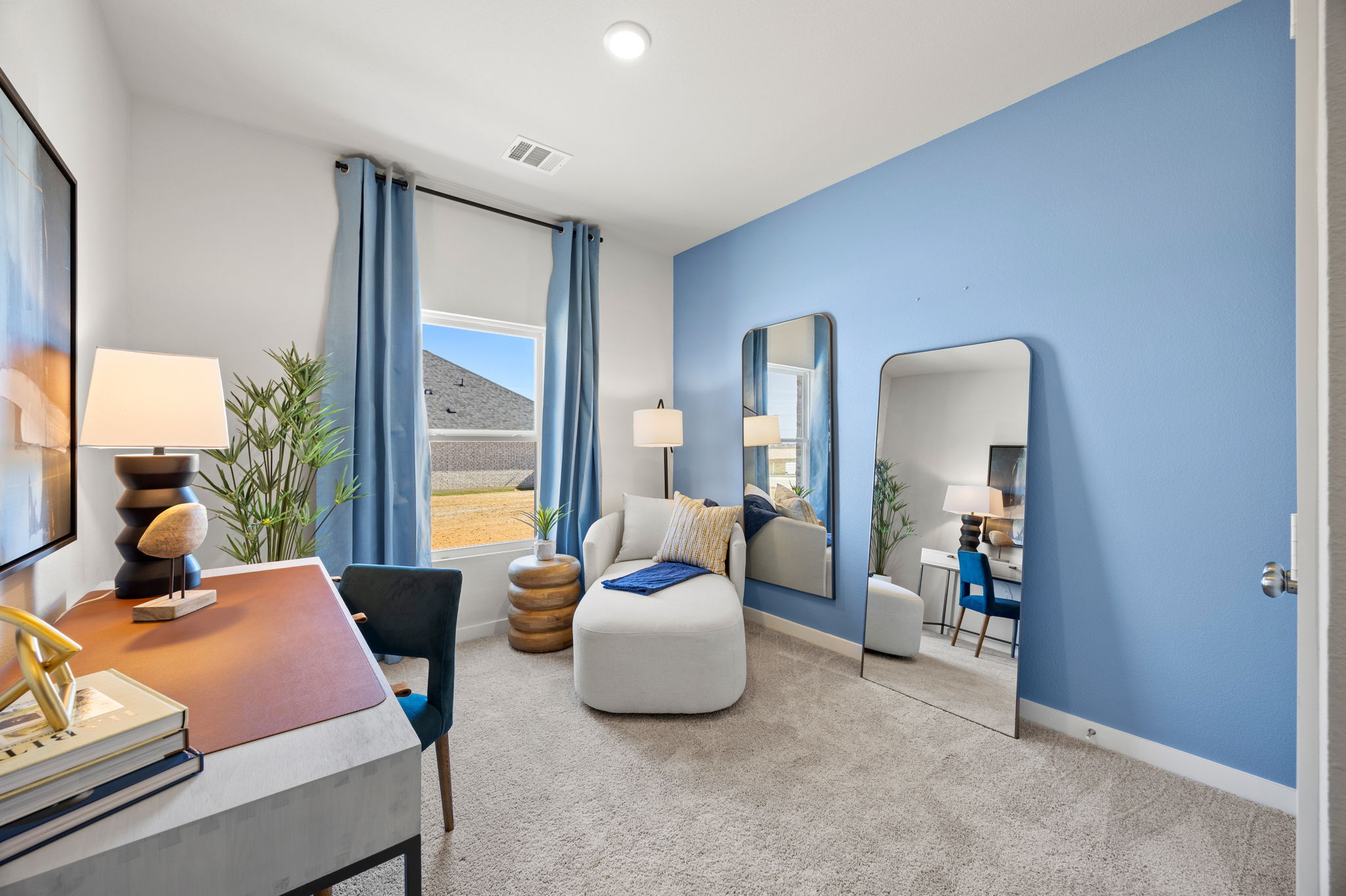 A living room with a blue wall.