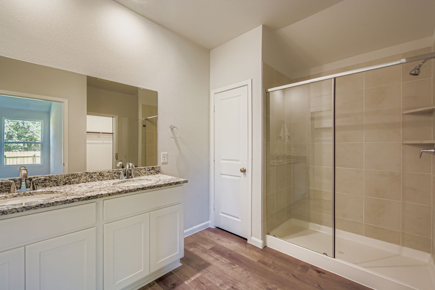 A bathroom with a glass shower.