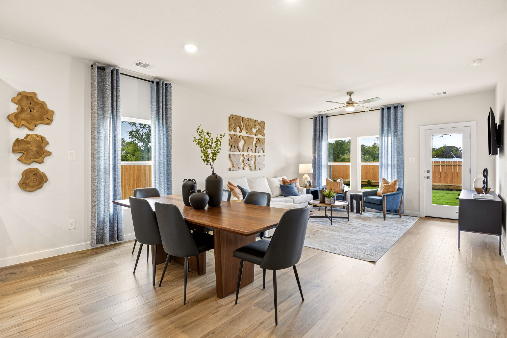 A large room with a table and chairs.