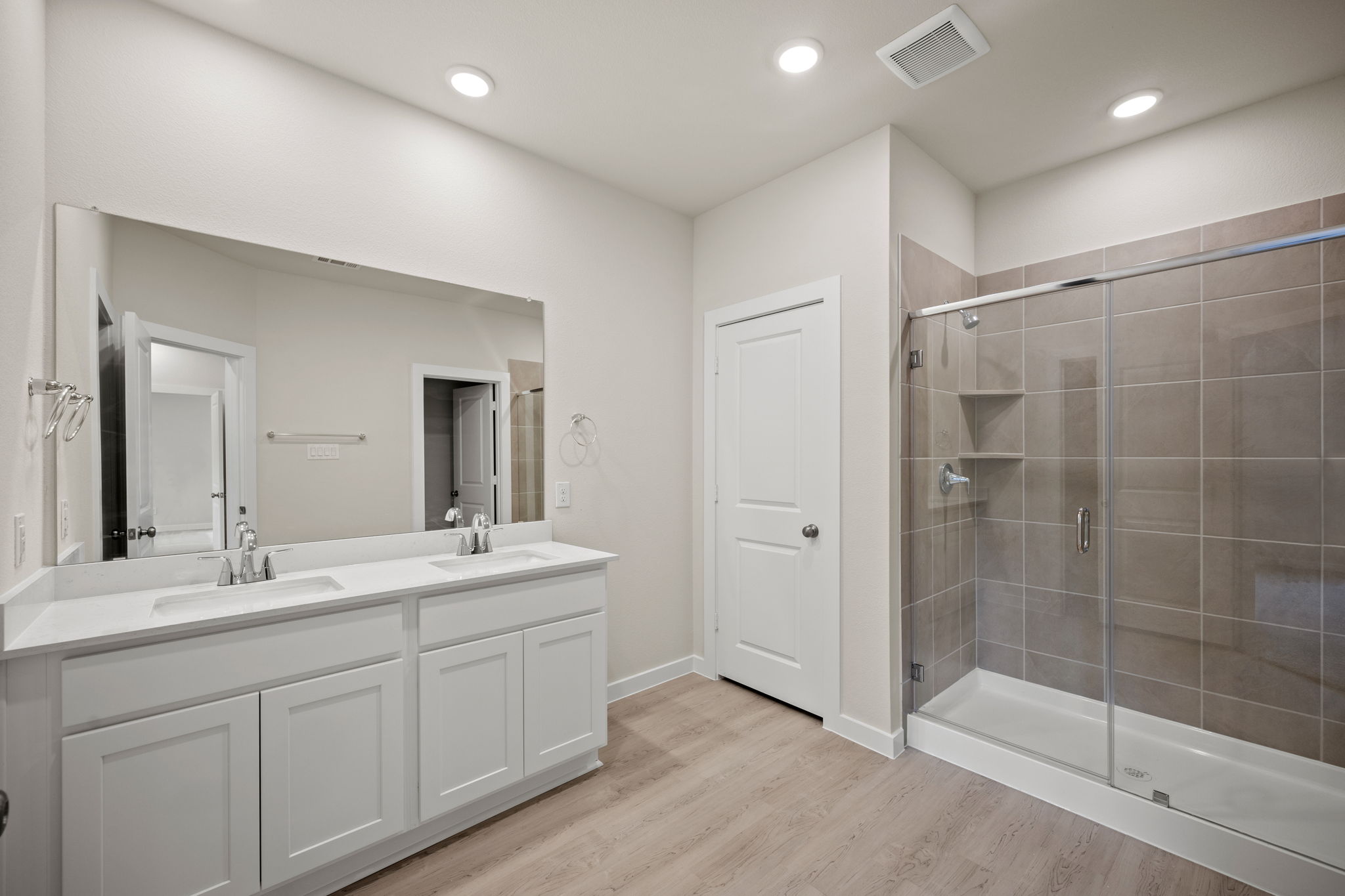 A bathroom with a glass shower.
