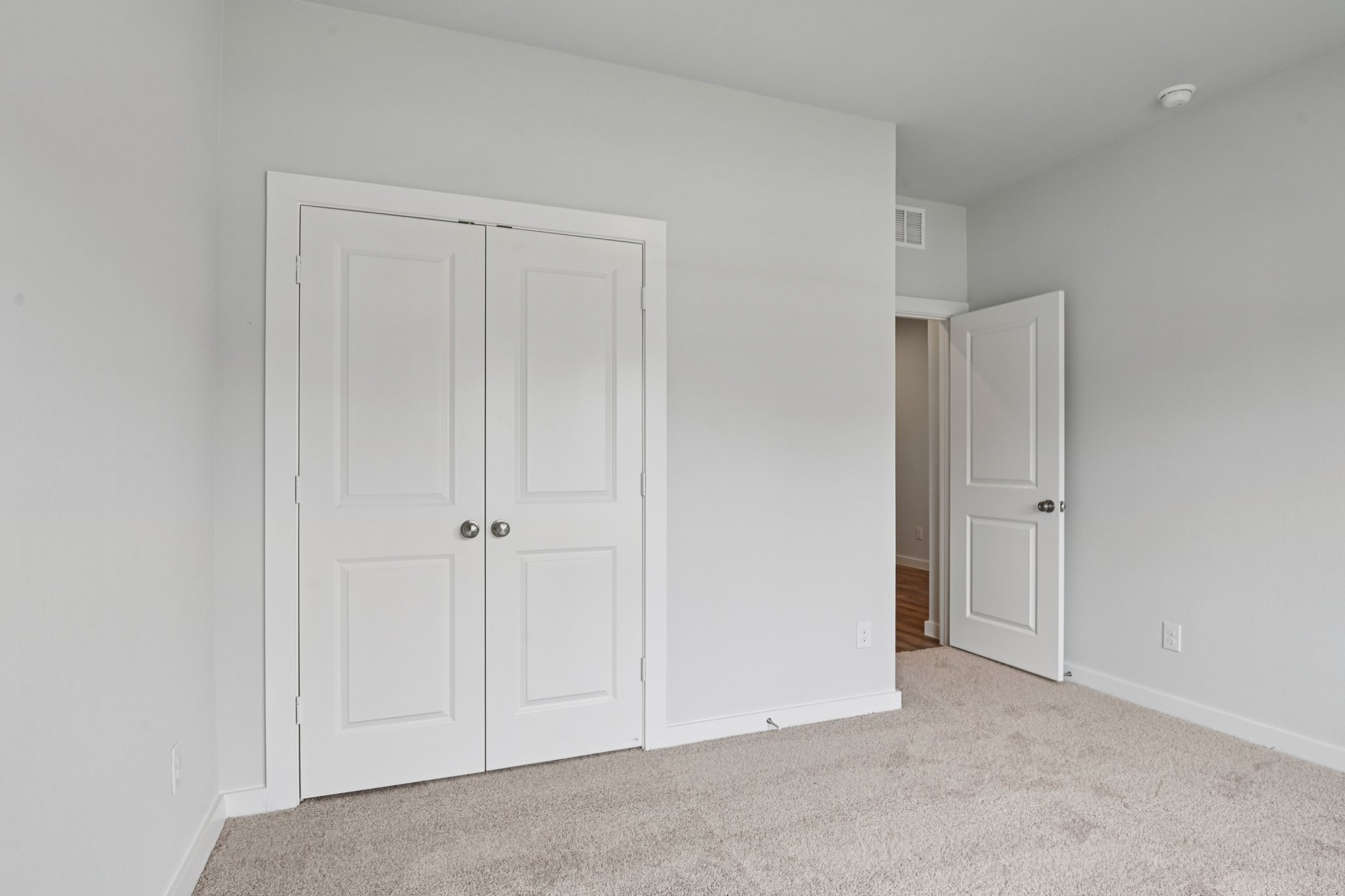 A room with white doors.