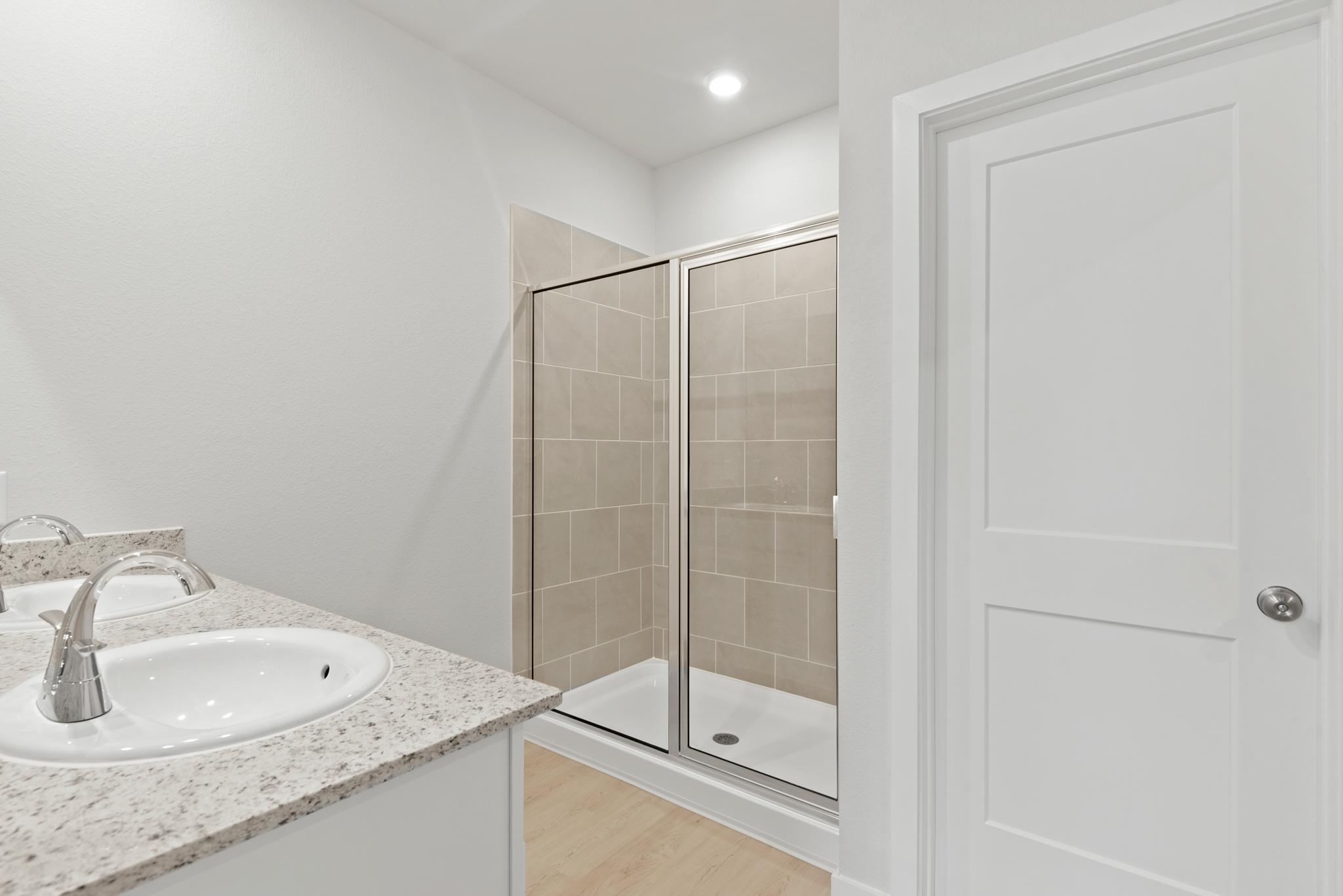 A bathroom with a glass shower.