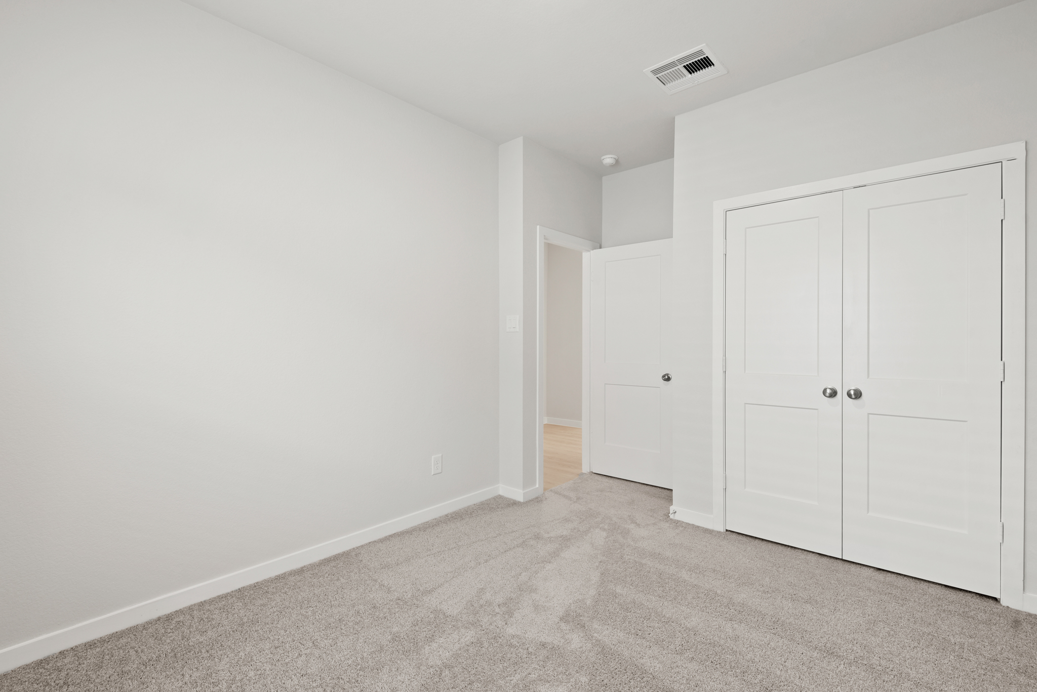 A room with white doors.