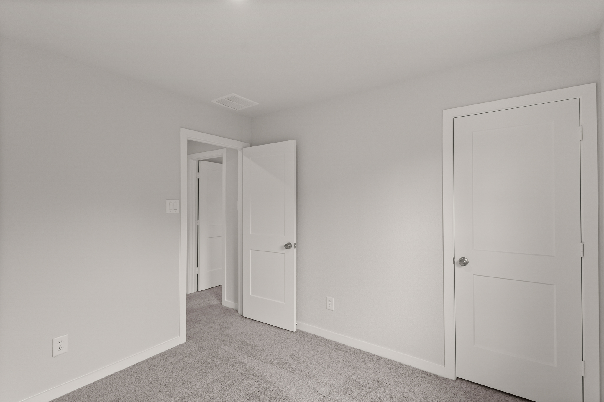 A room with white doors.