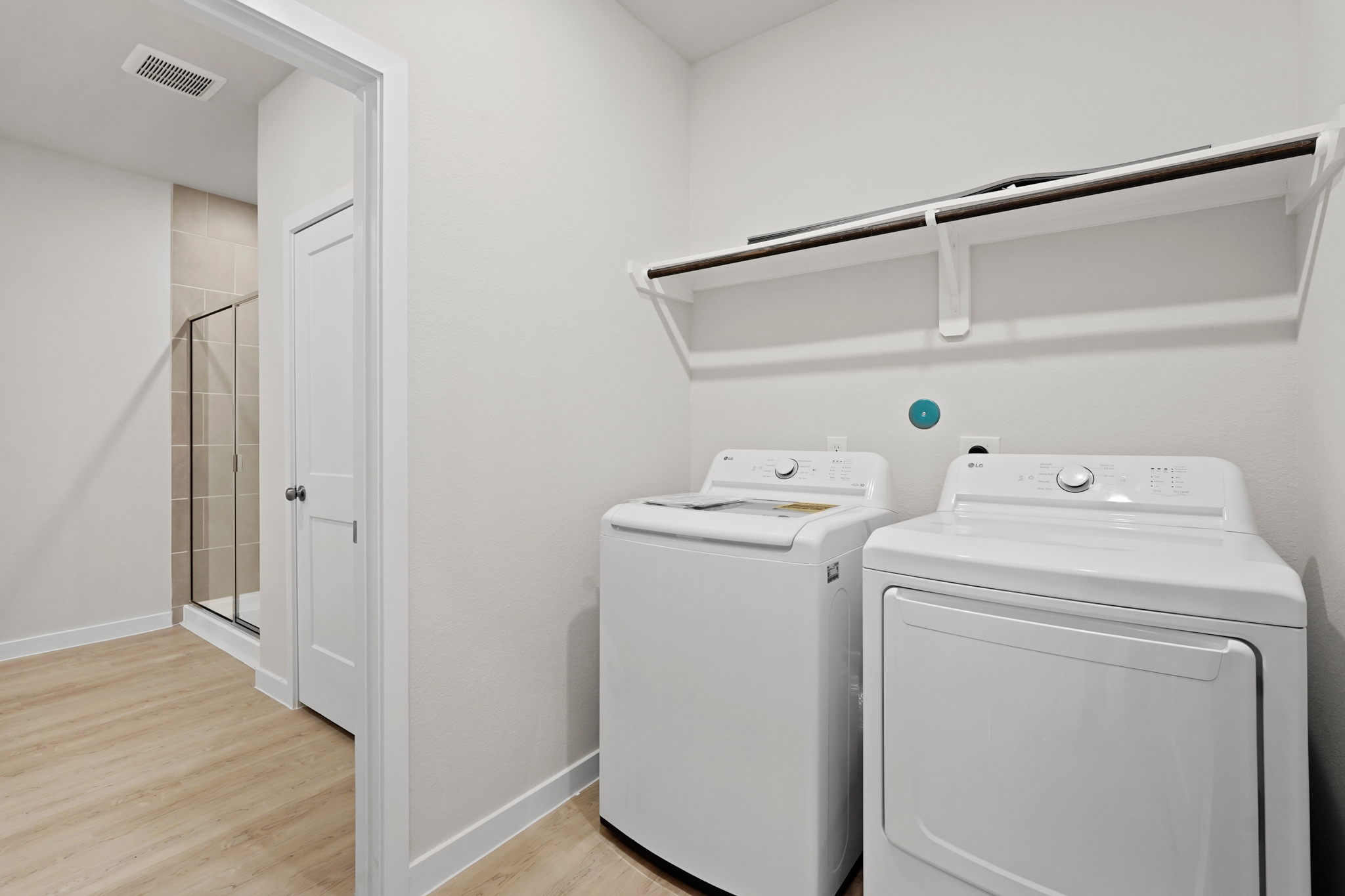 A laundry room with a washer and dryer.