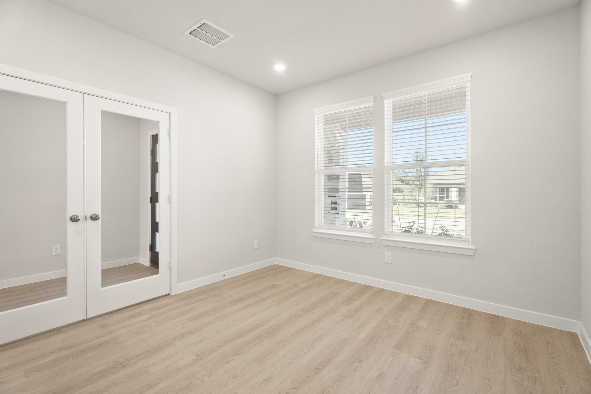 A room with a door and a window.