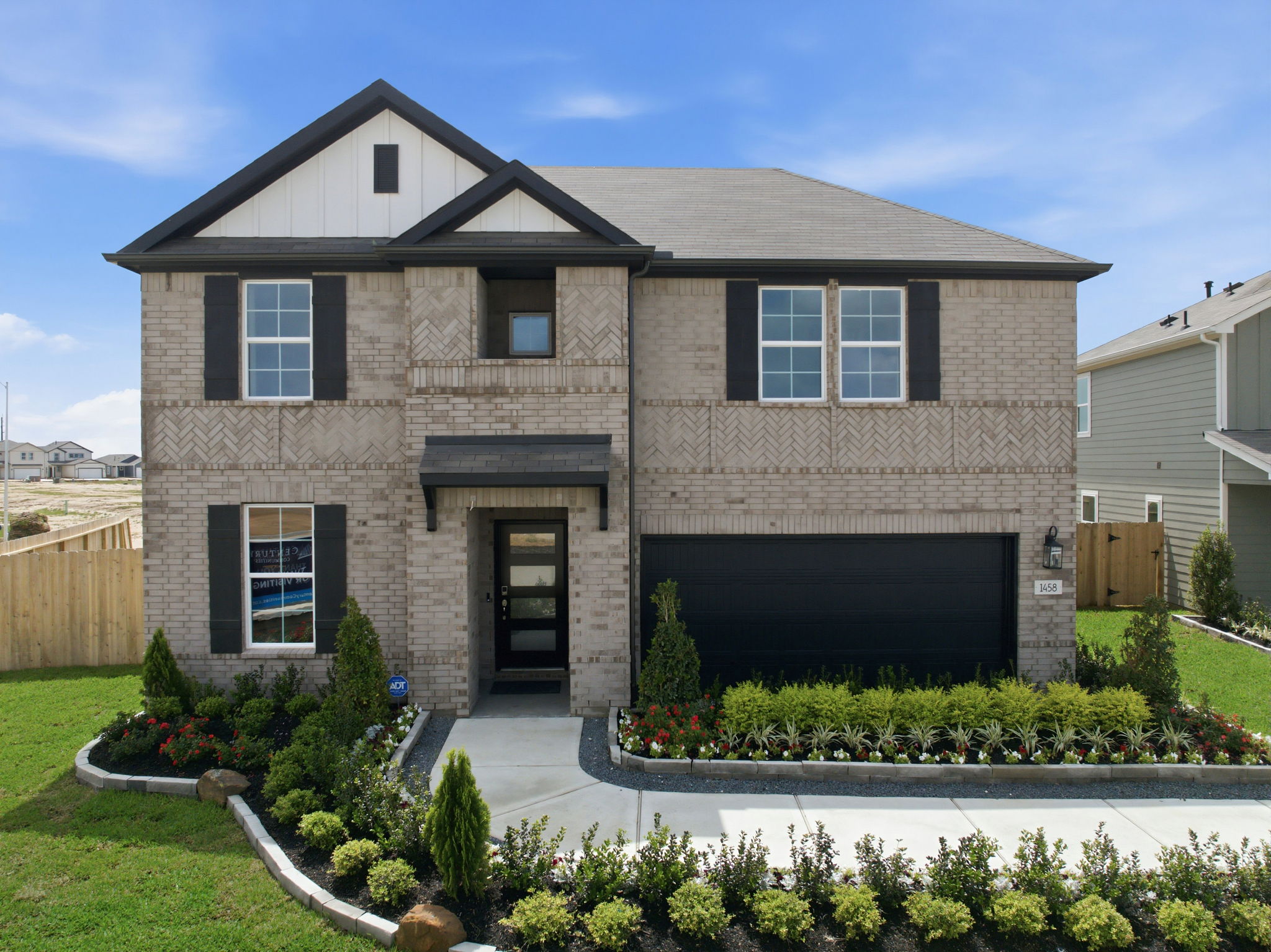 A house with a garden in front.