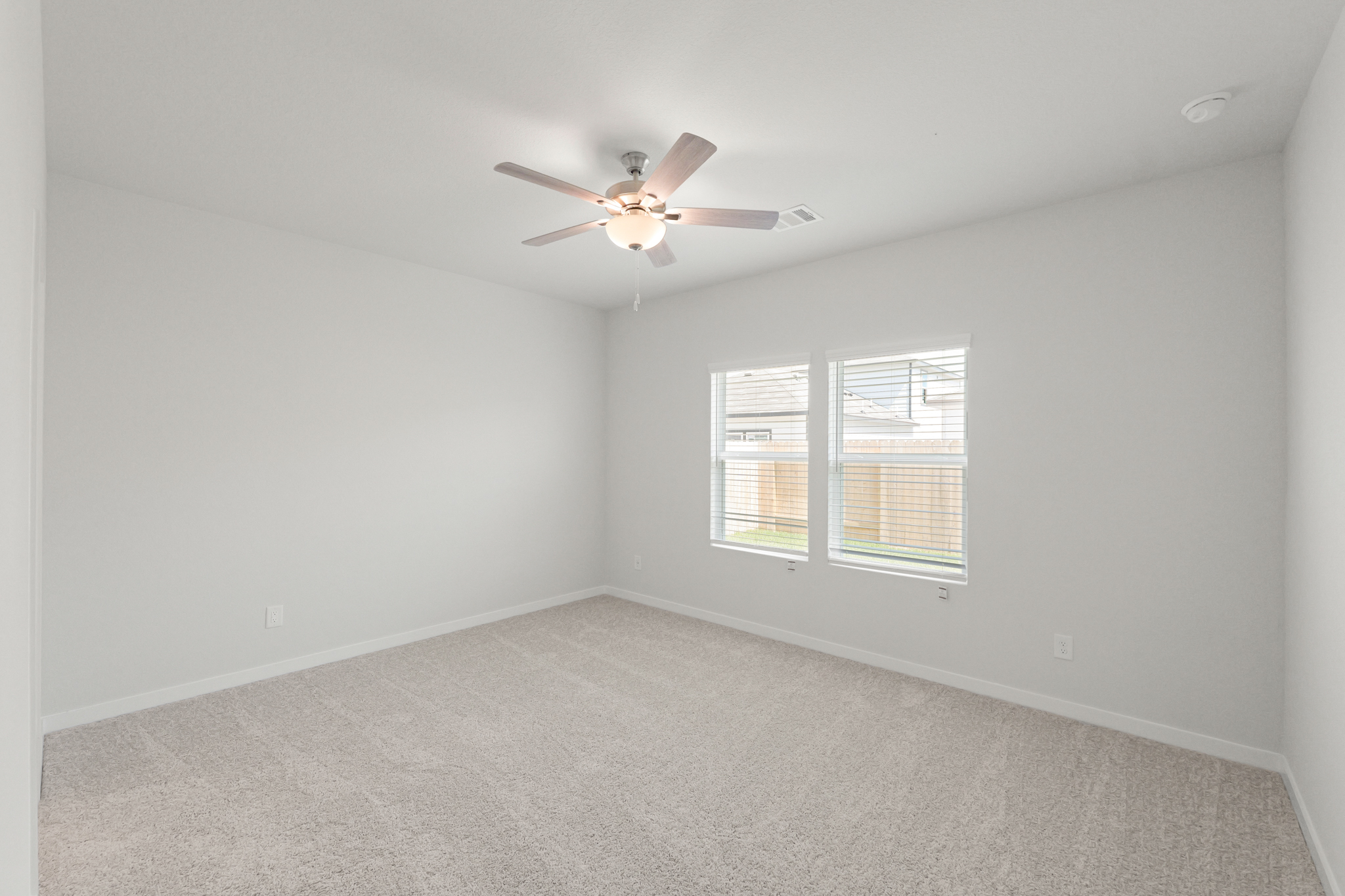 A ceiling fan in a room.
