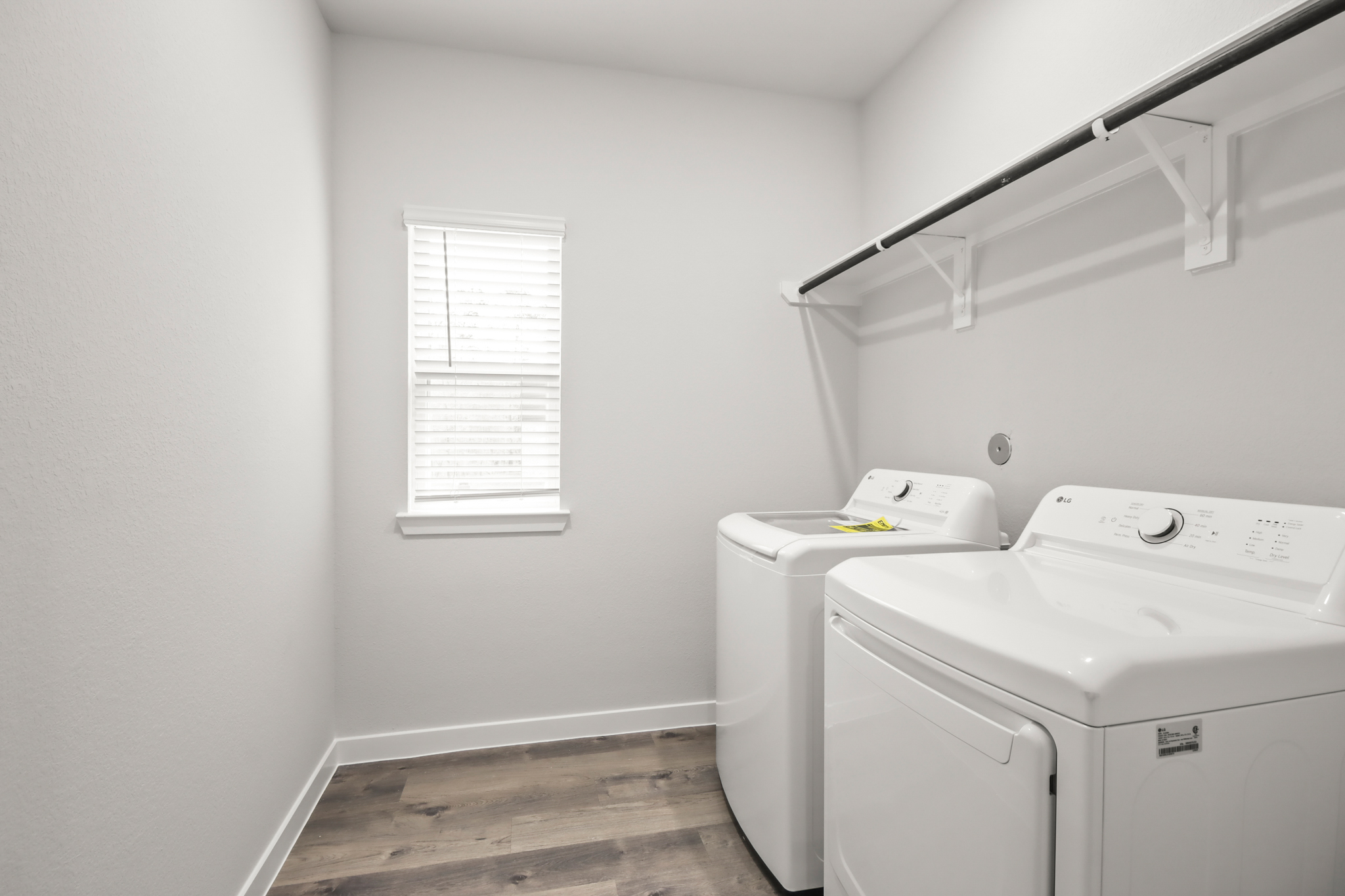 A laundry room with a washer and dryer.