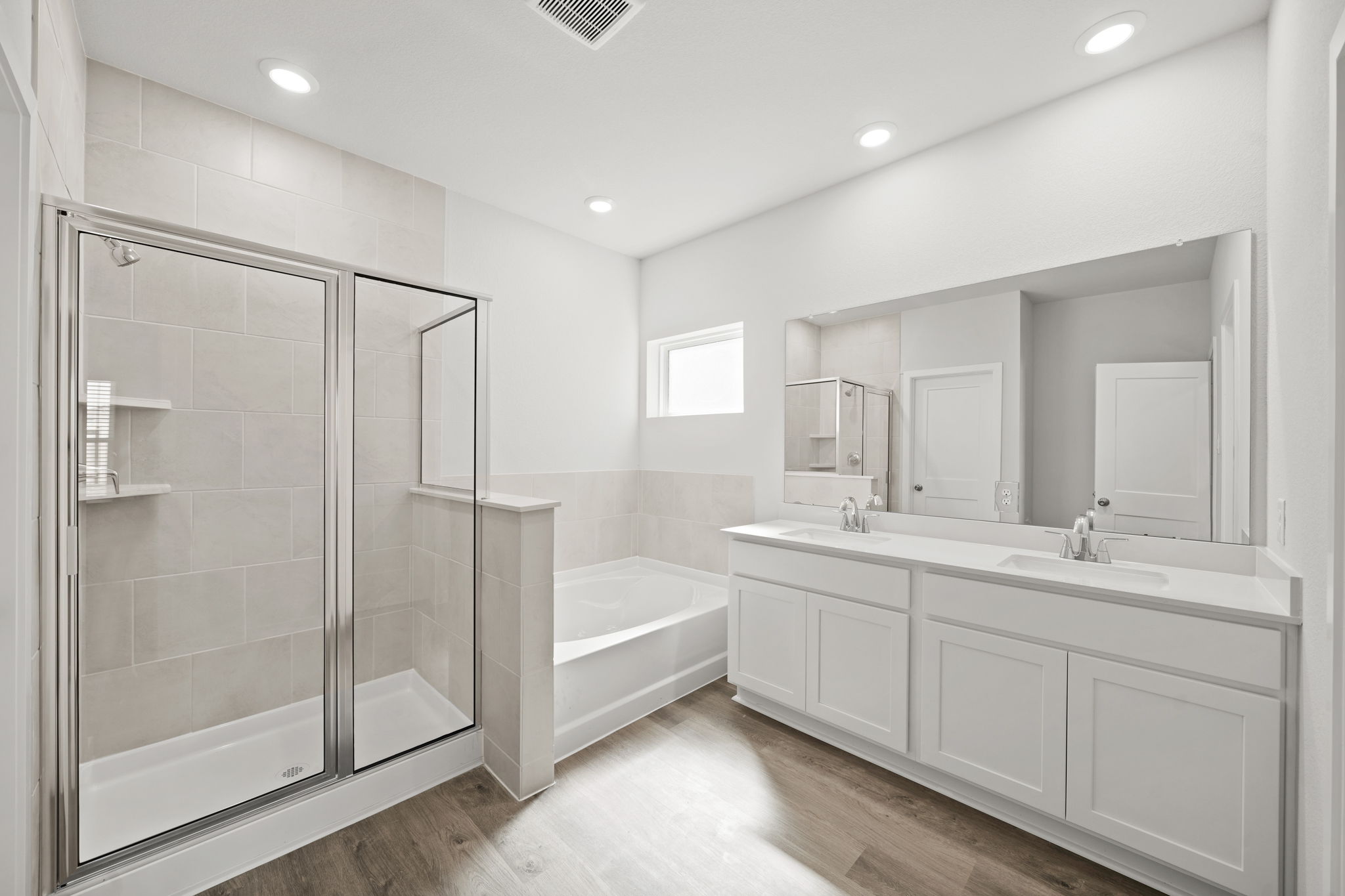 A bathroom with a glass shower.