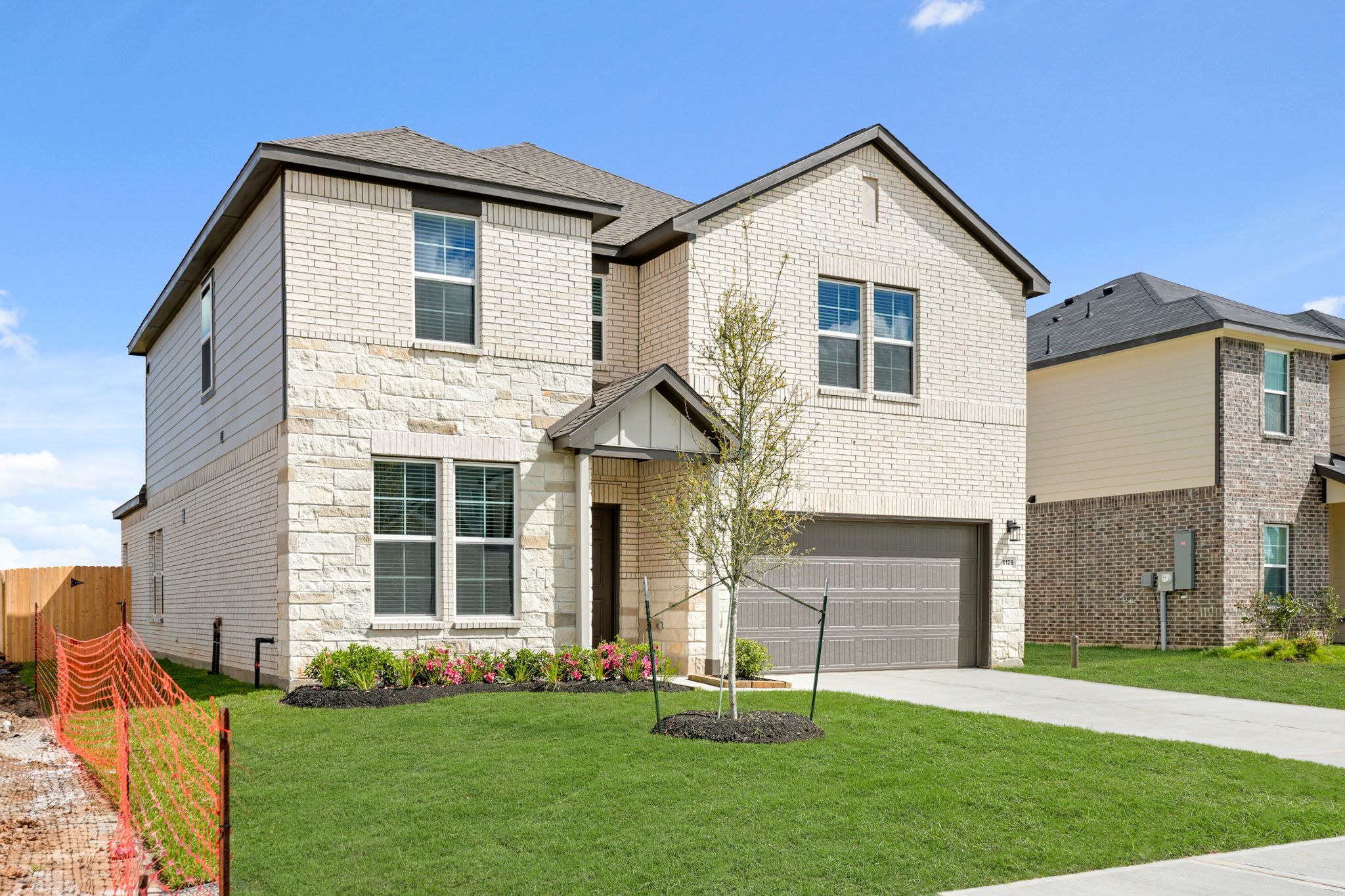 A house with a lawn and trees.