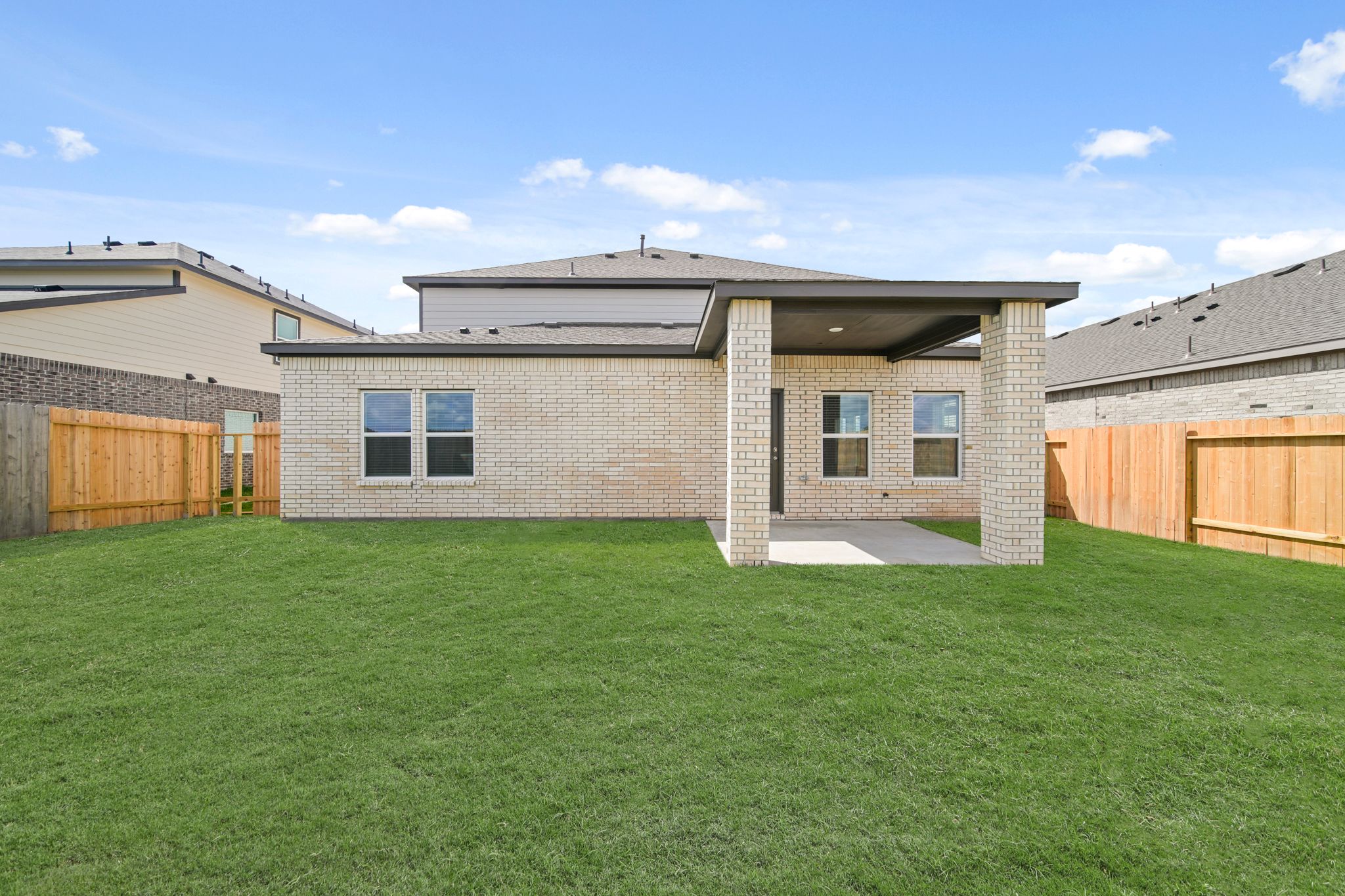 A house with a grass yard.