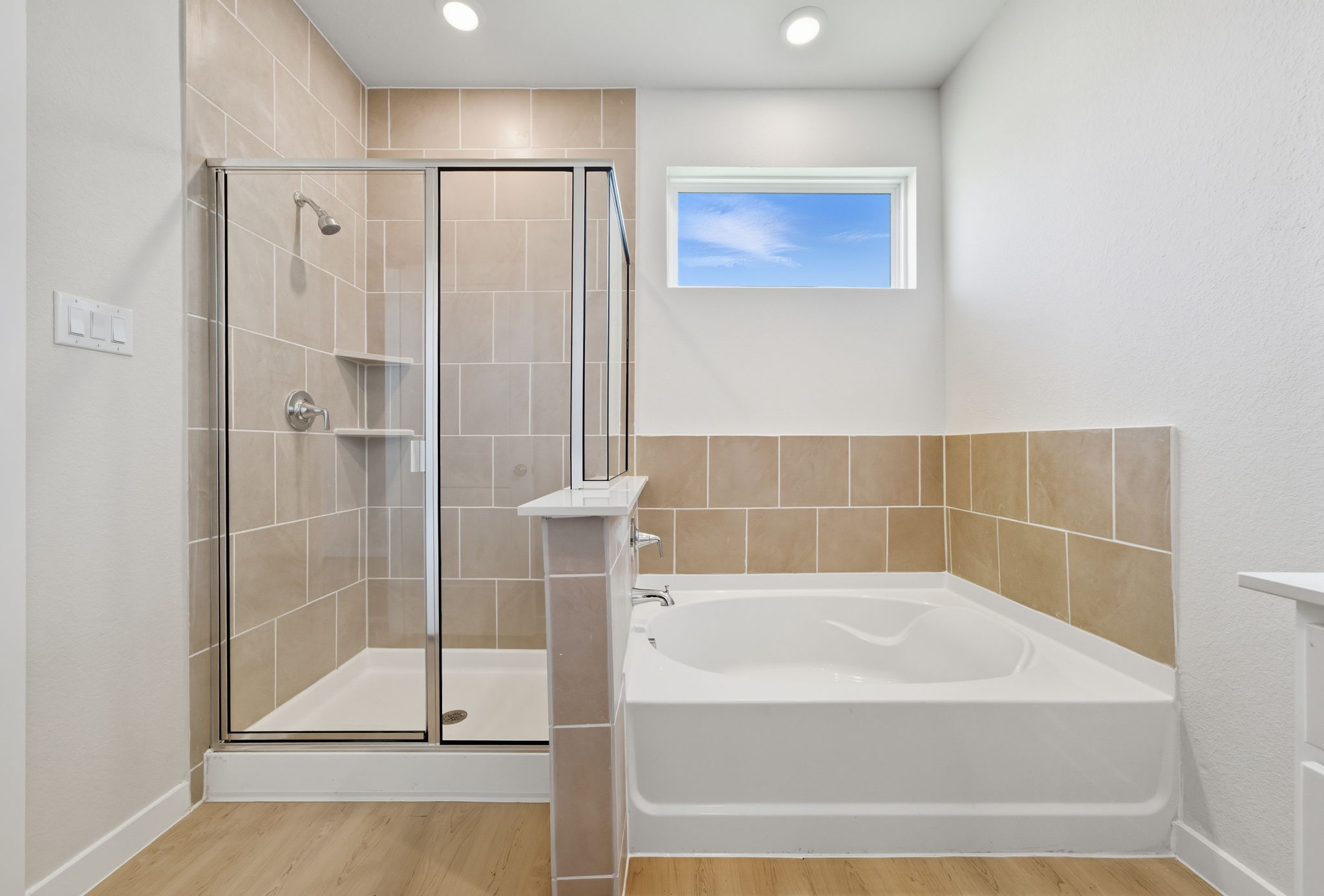 A bathroom with a glass shower.