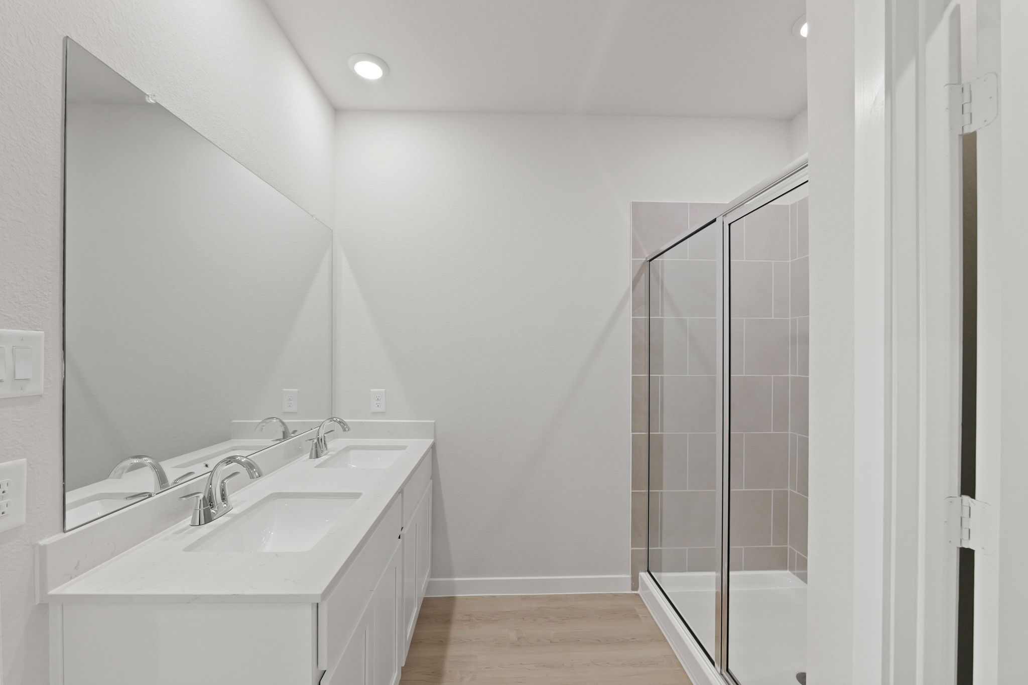 A bathroom with a glass shower.