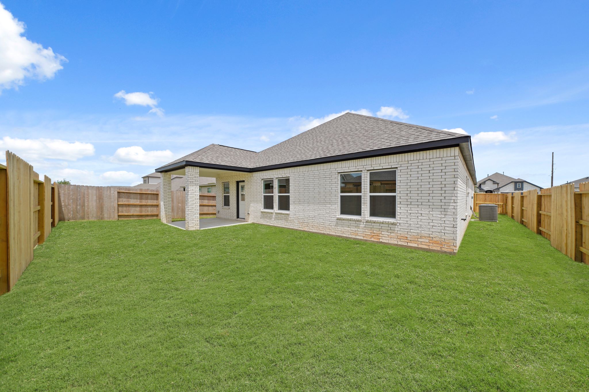 A house with a green lawn.