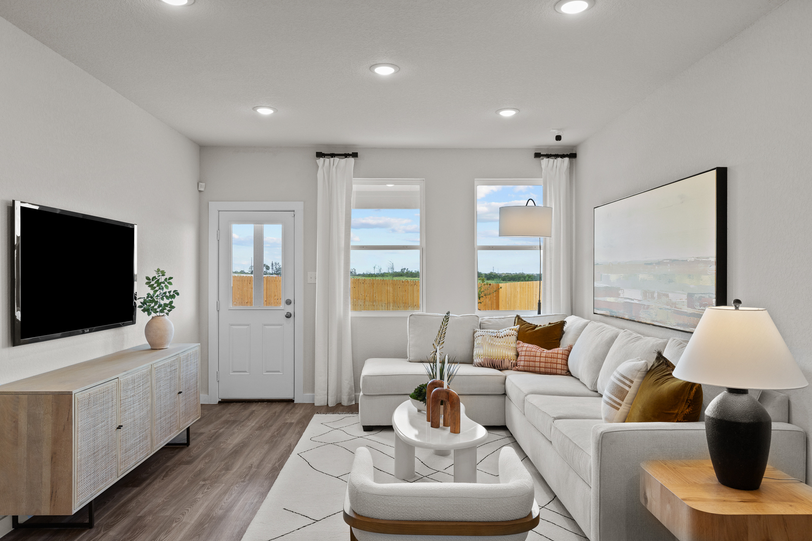 A living room with a tv and a couch.