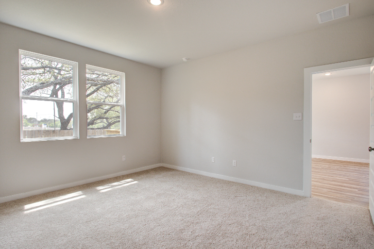 A room with a door and windows.