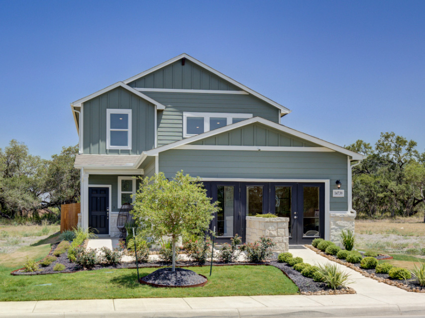 A house with a large front yard.