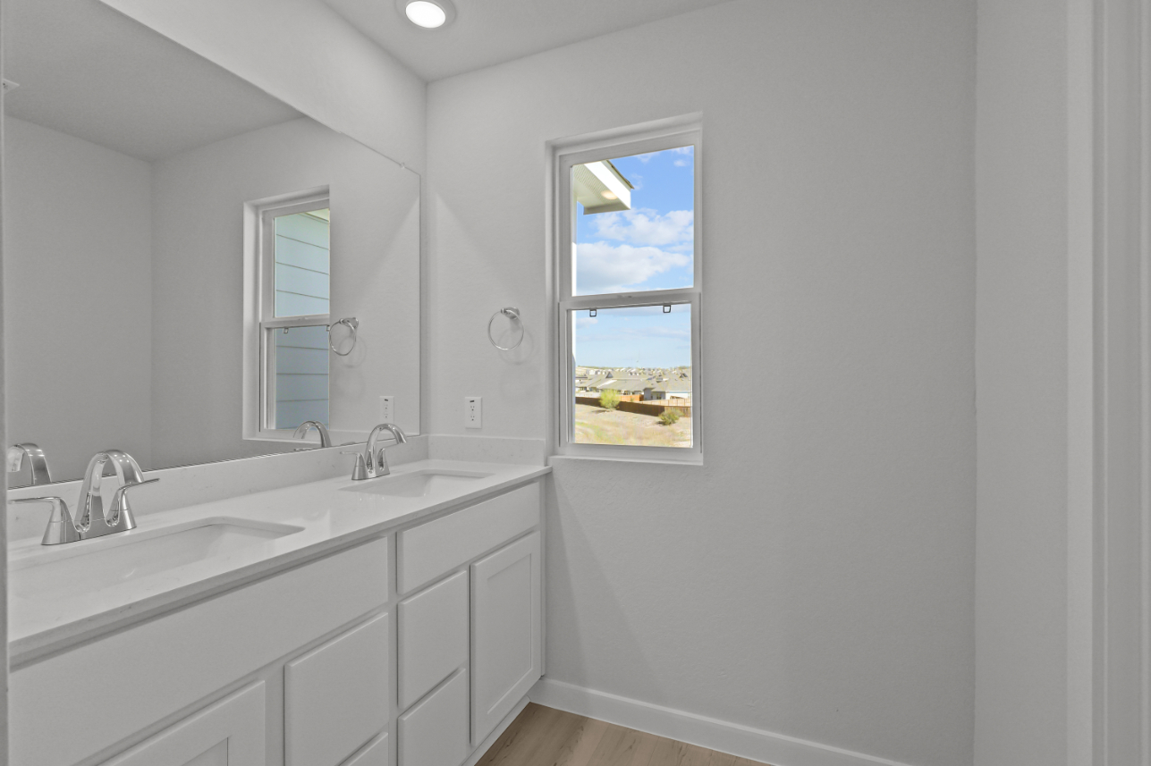 A bathroom with a large window.