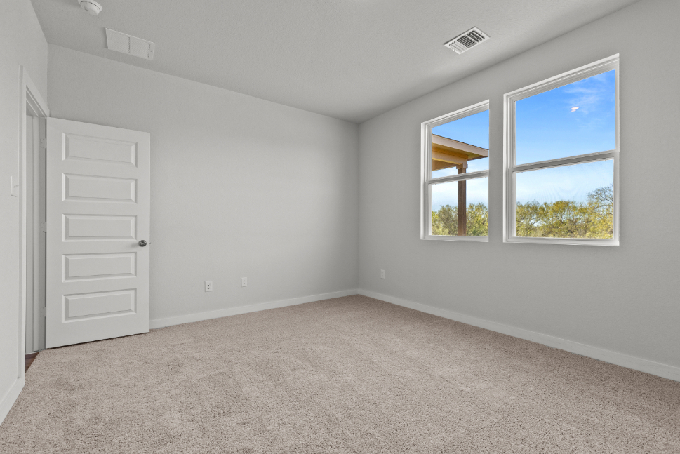 A room with a window and a door.