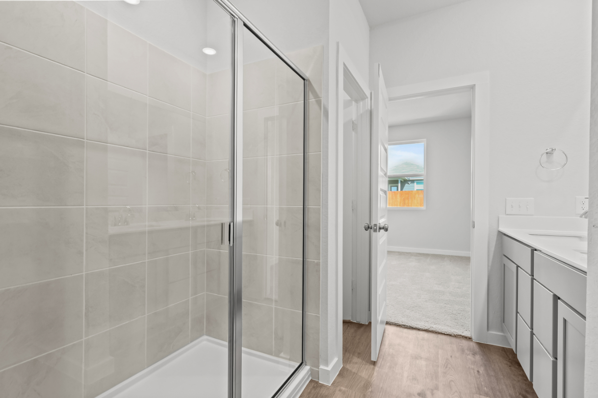 A bathroom with a glass shower.