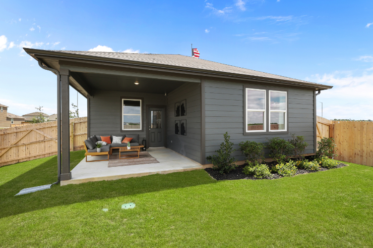 A house with a lawn and a fence.