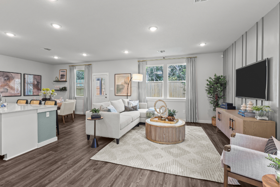 A living room with a large television.