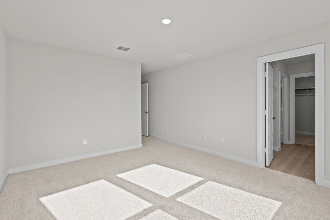 A room with a rug and a rug.