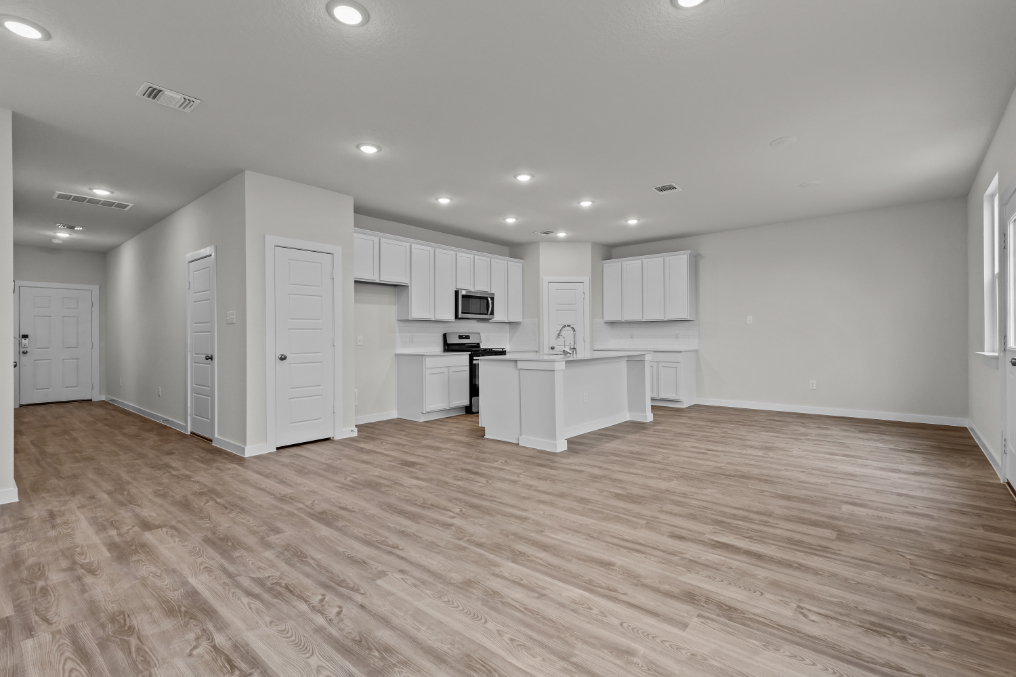 A large kitchen with white cabinets.