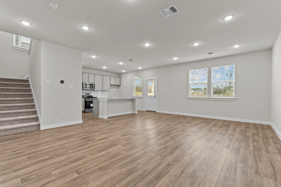 A large kitchen with white cabinets.