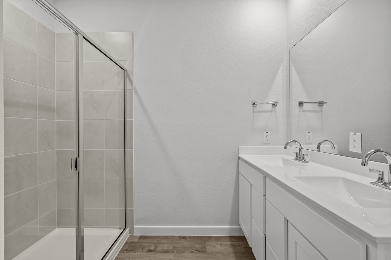 A bathroom with a glass shower.