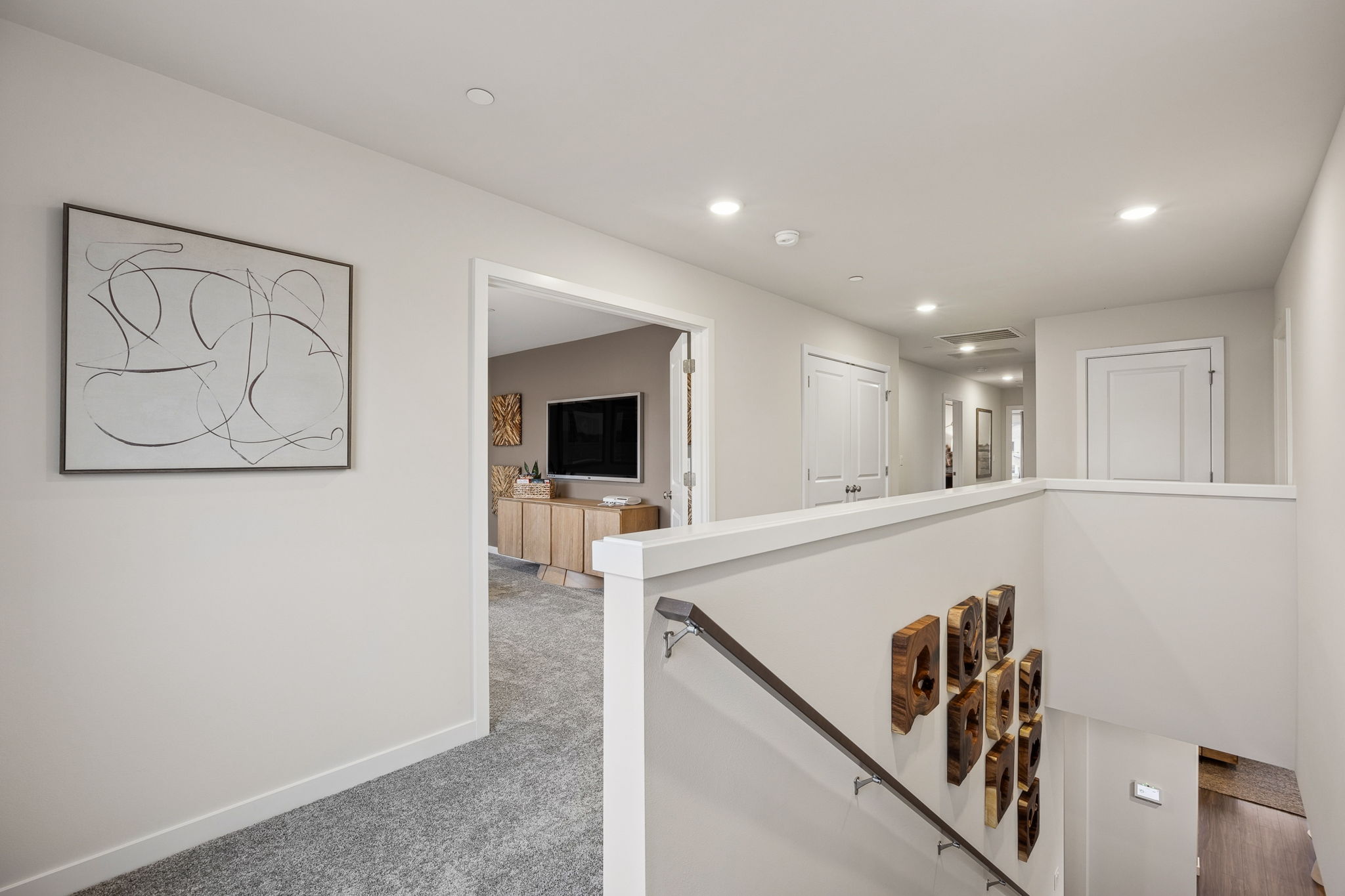A white room with a staircase.