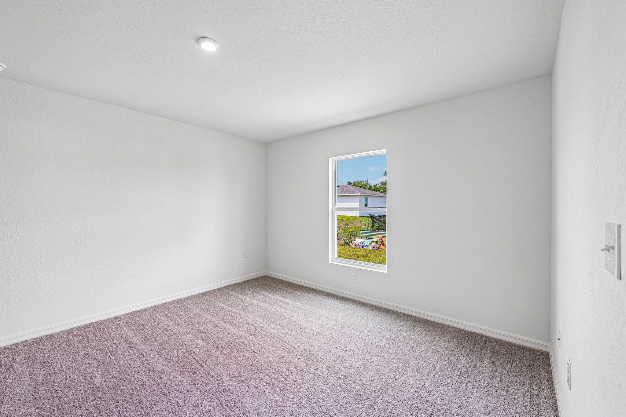 A hallway with a painting on the wall.