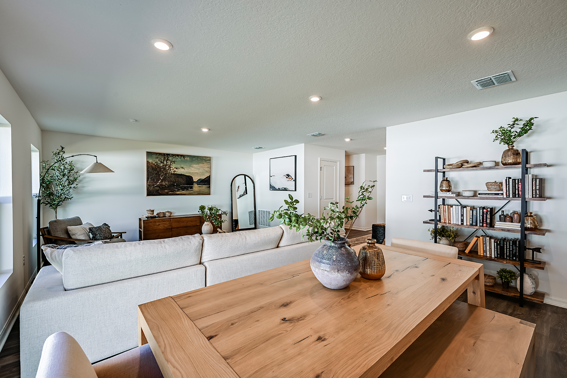 A living room with a table and a couch.