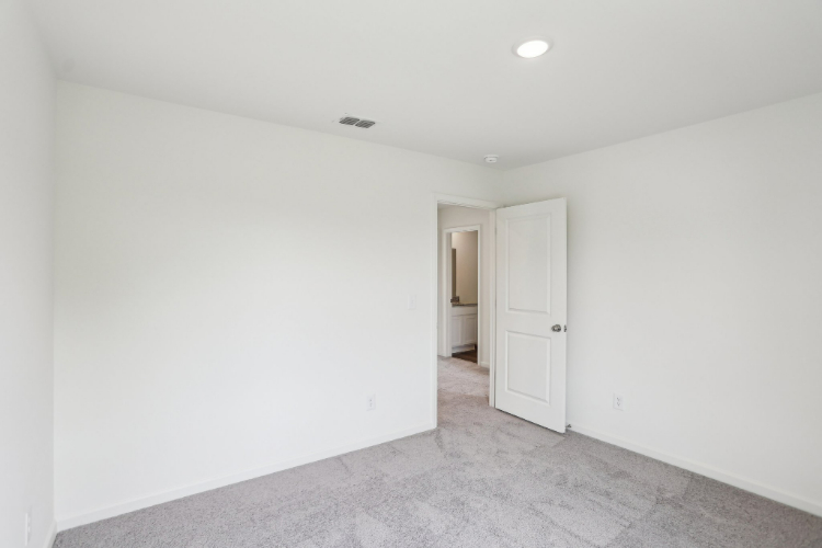 A hallway with white doors.
