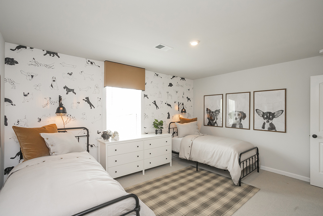 A bedroom with two beds.