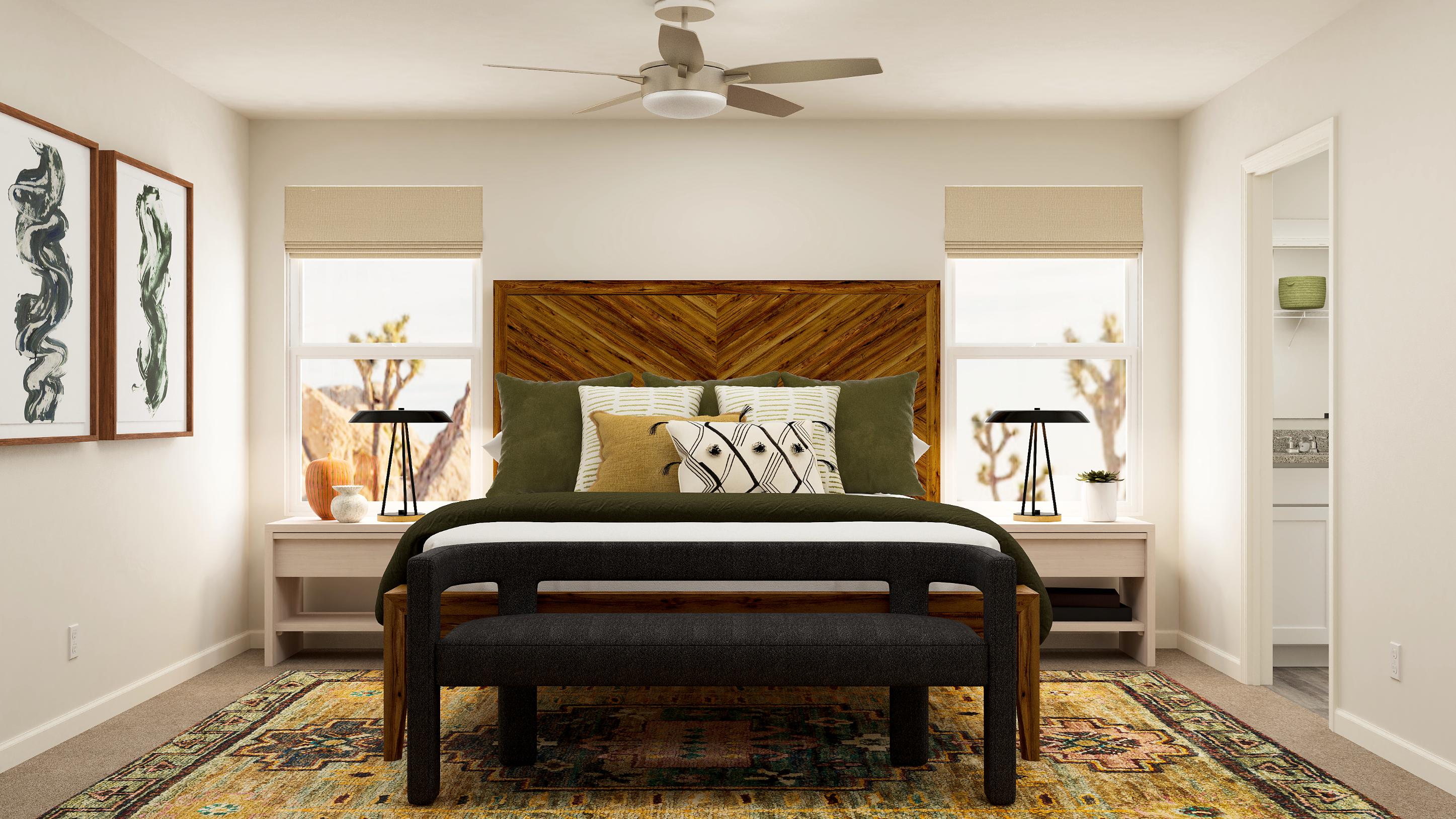 A bedroom with a bed and a fan.