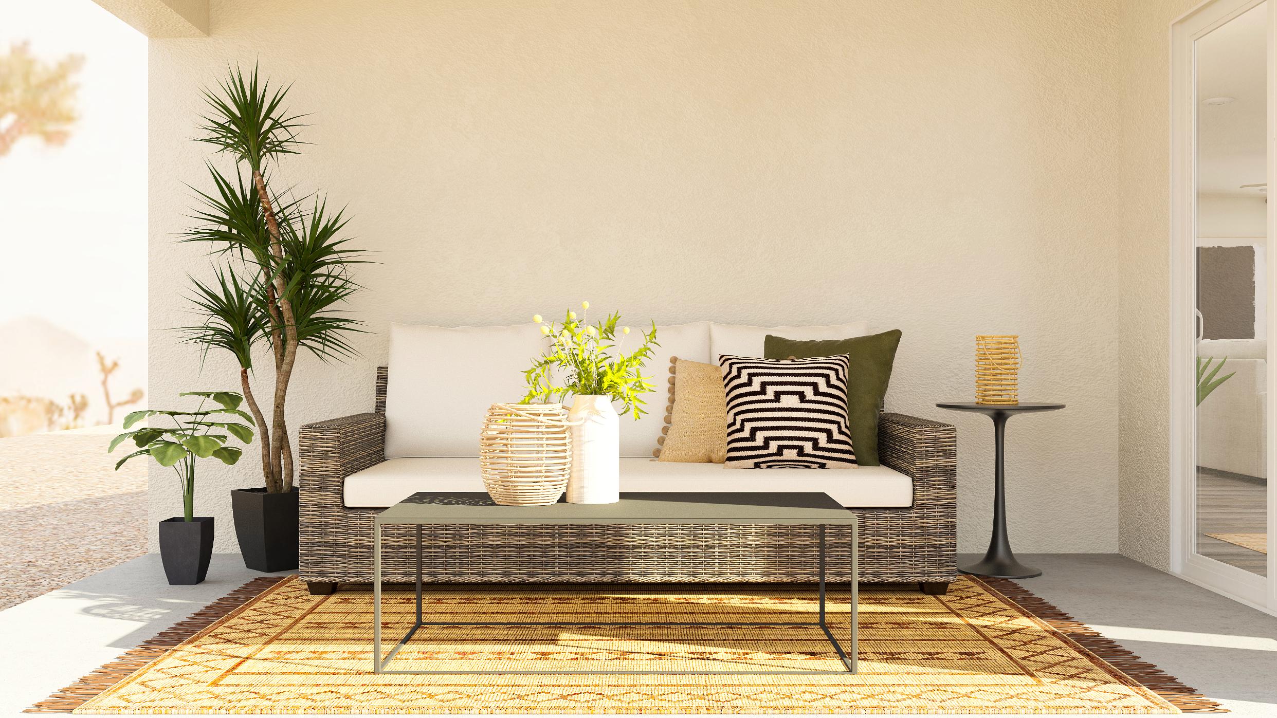 A couch with a table and plants.