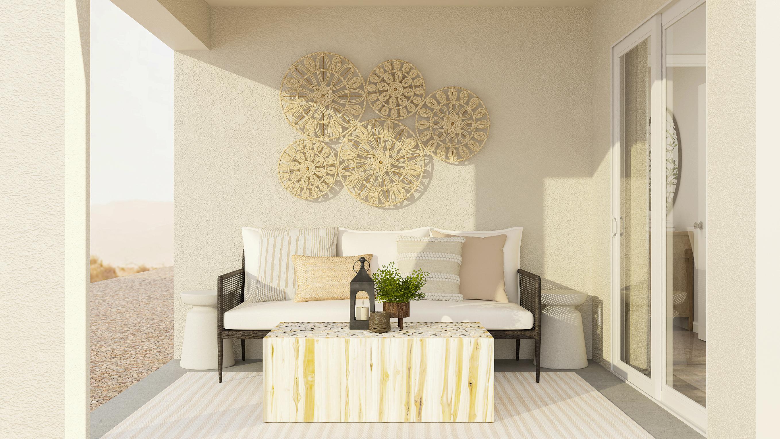 A room with a couch and a table with a bottle of wine.