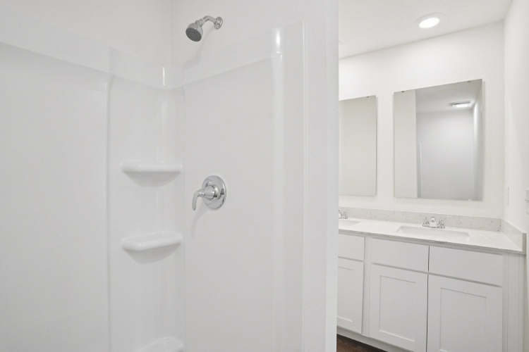 A bathroom with a sink and a mirror.