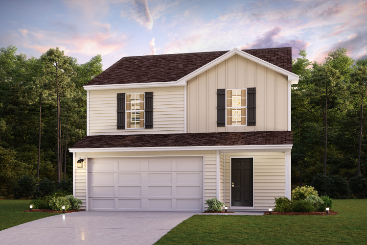 A house with a garage and trees in the back.